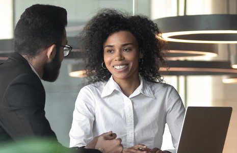 Man and woman having a meeting in a corporate setting