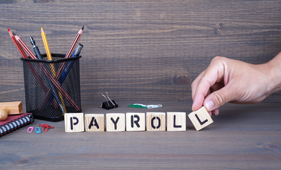 image of block with the words payroll